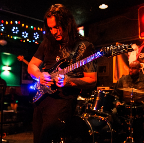 Ryan Maza burning up the stage with his Ibanez Jem, nicked-named 'The Beast.'